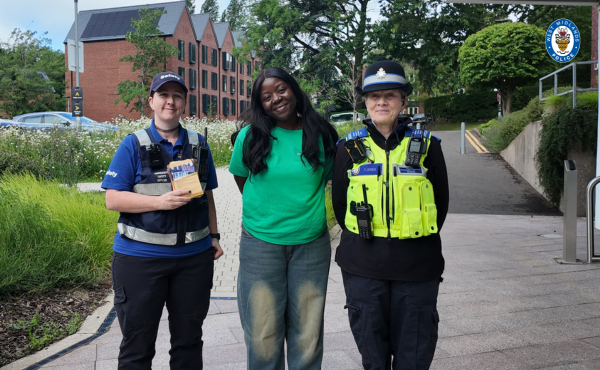 PCSO Jones with a student ambassador and campus security staff