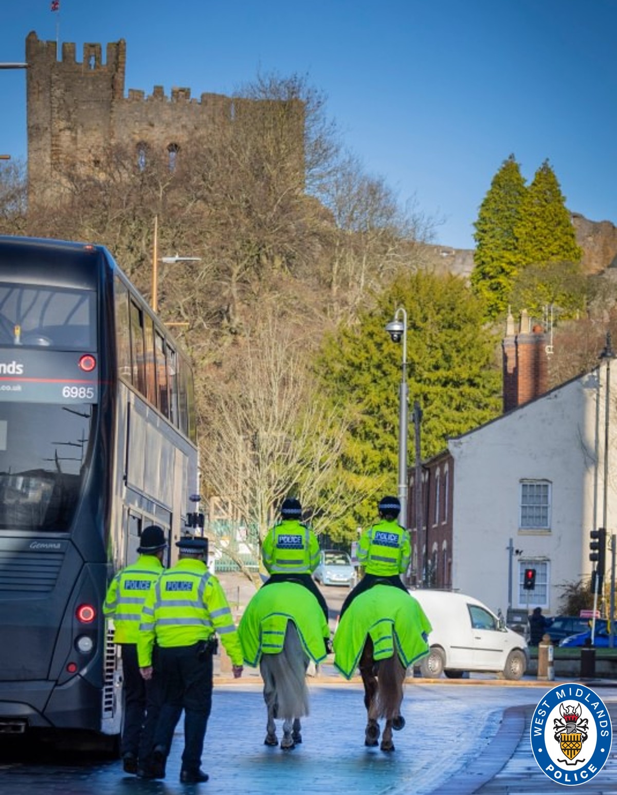 Officers and two police horses and on patrol in Dudley town centre