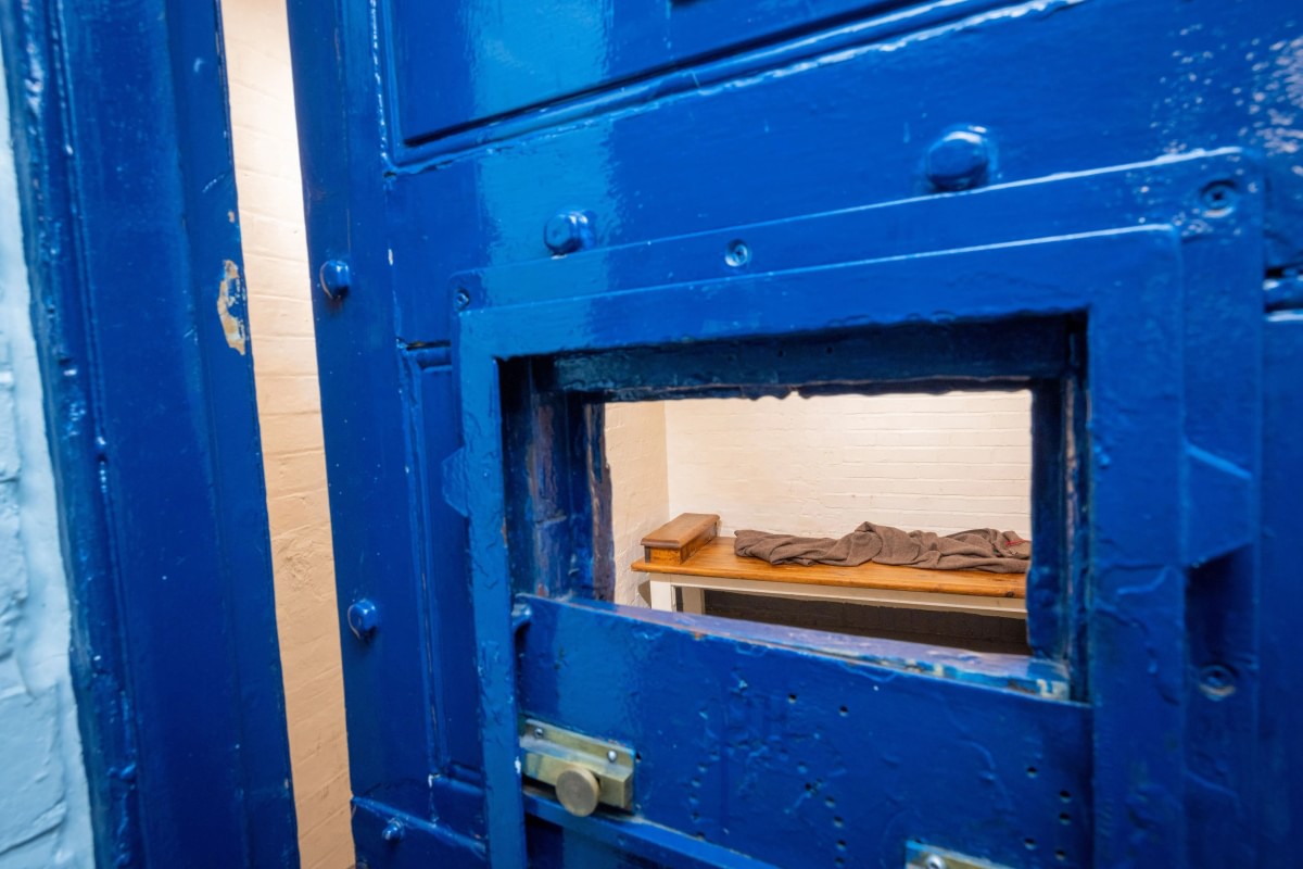 Taking a look inside one of the cells at the museum