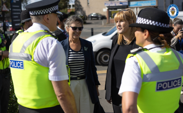 MP and policing minister talking to police officers