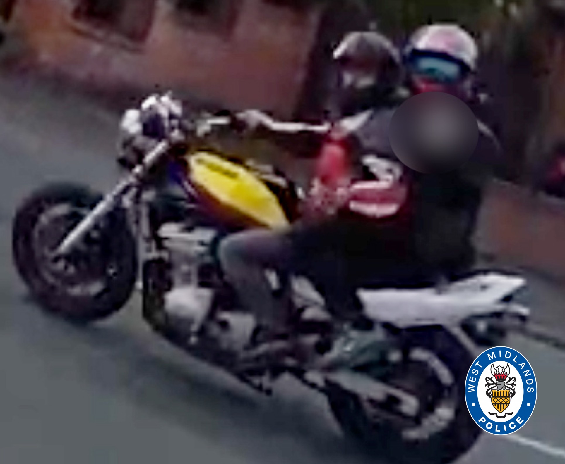 image of two riders on a bike