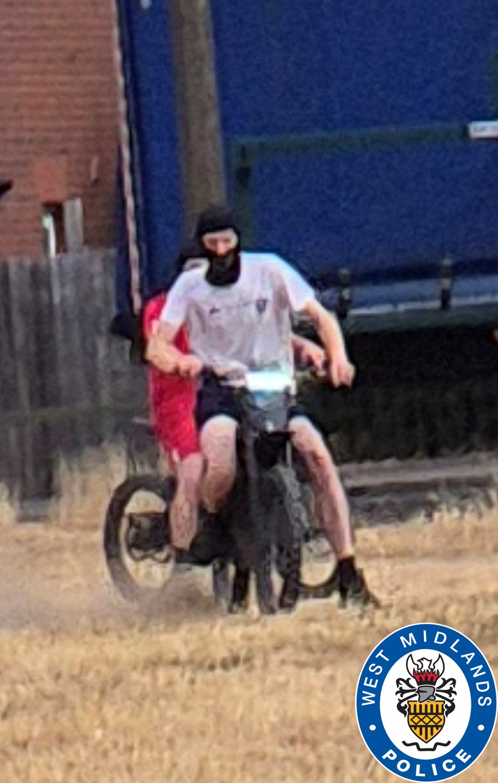 image of two people on a bike