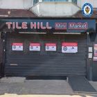 tile hill mini market with closure order sign on the shutters